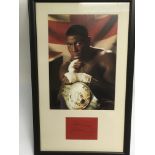 A Frank Bruno signed photo display, approx 31.5cm x 51cm.