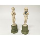 A Quality pair of Art Deco K Preiss carved ivory figures of a nude boy and girl. on polished green