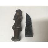 An unusual carved black stone carving and a carved