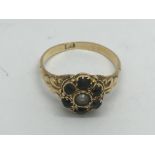 An 18ct gold emerald and pearl ring, approx 3.5g and approx size P.