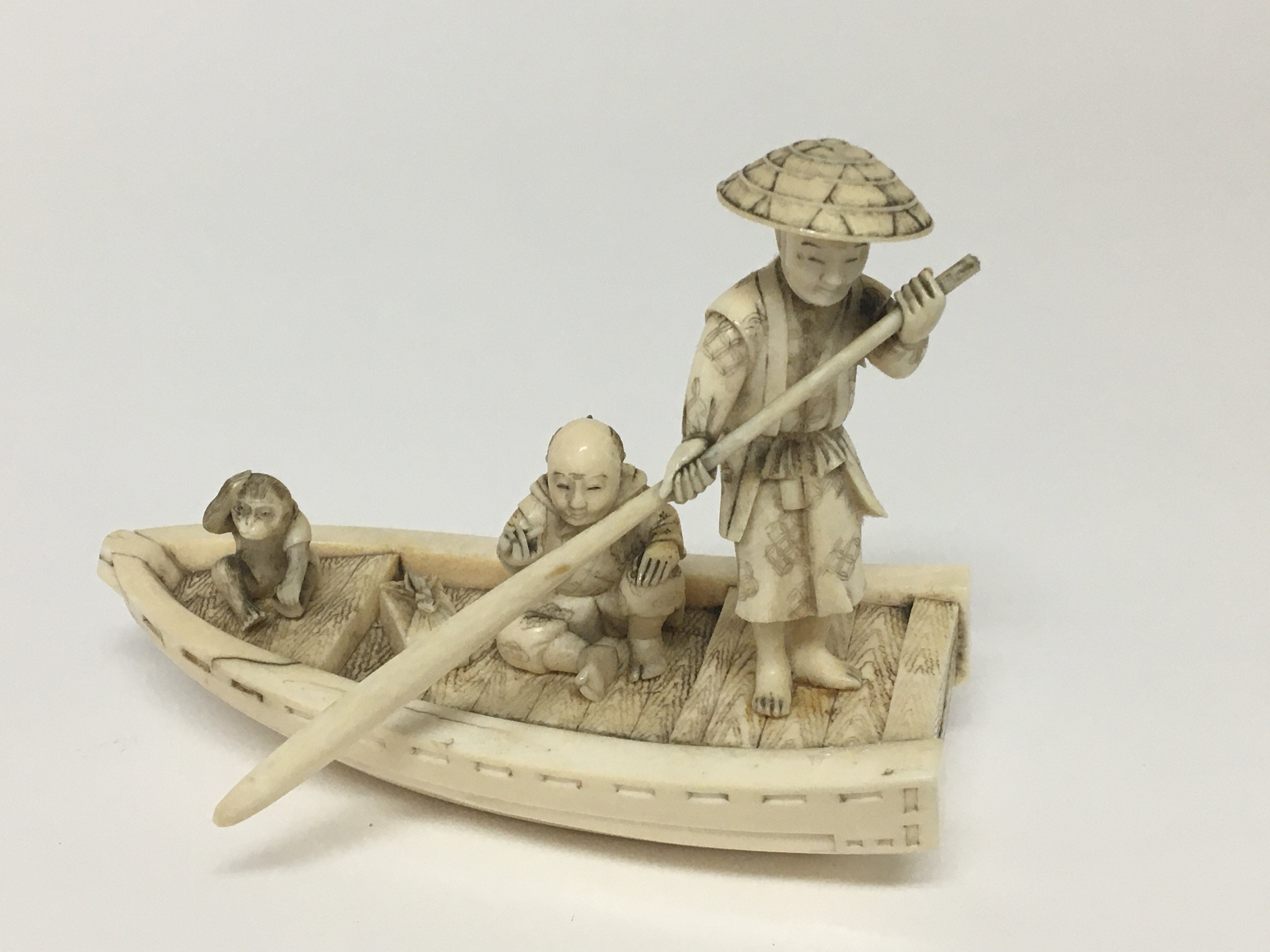 A carved late 19th century ivory carving in the fo