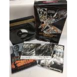 A collection of James Bond items including a boxed