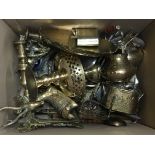 A box containing a variety of brassware items incl
