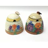Two Clarice Cliff beehive jars in Crocus and Gayday pattern