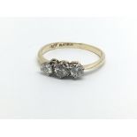 An 18ct and platinum three diamond ring, approx 1.