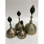 Four Georgian hand bells with banded decoration