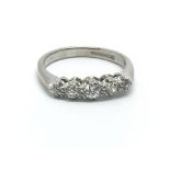 An 18ct white gold five stone diamond ring, approx