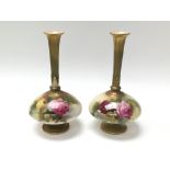 A pair of Royal Worcester fluted vases depicting roses