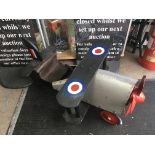 A child's sit on bi-plane 3 wheeled toy.