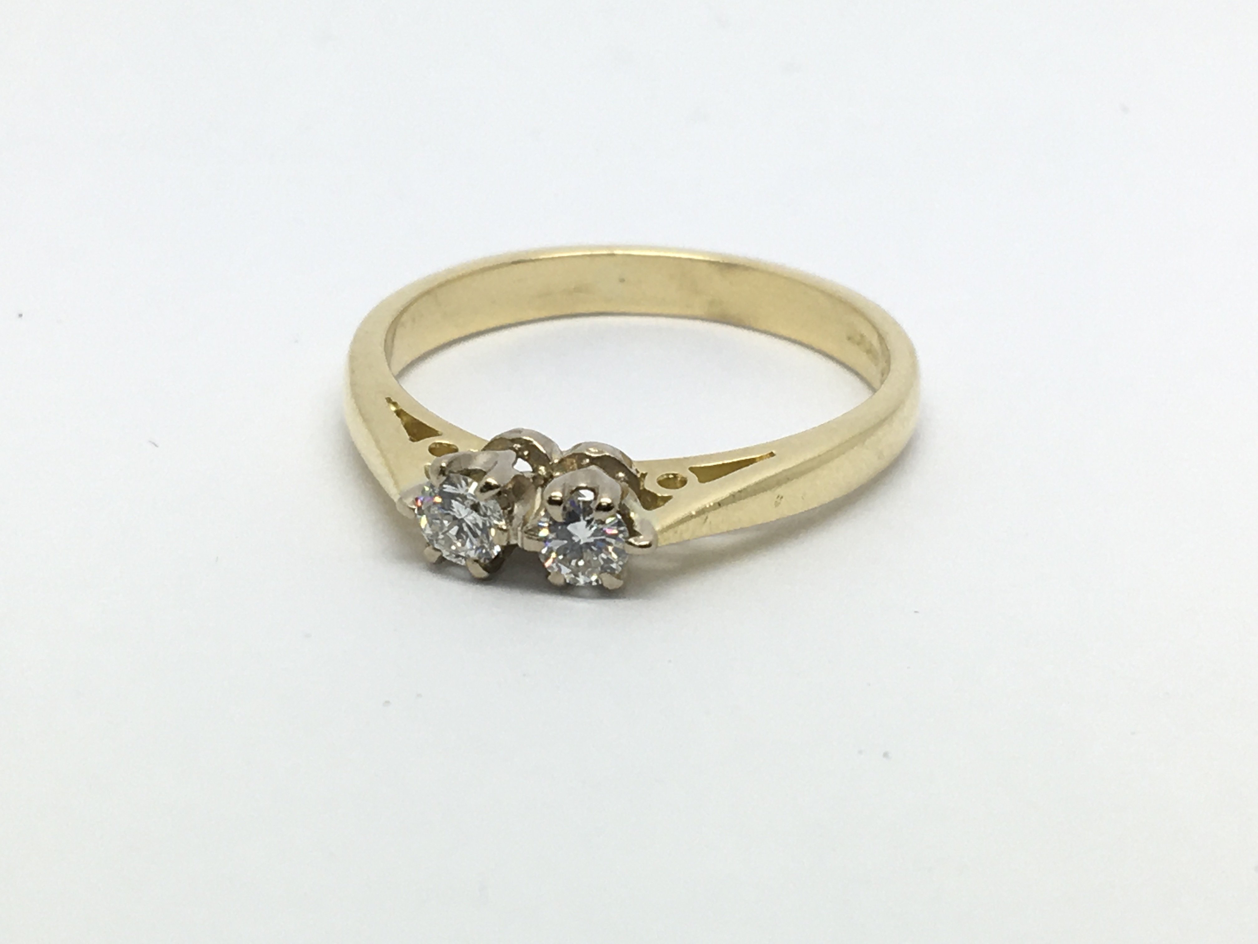 An 18ct gold two stone diamond ring, approx 1/4ct,