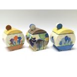 Three re-painted Clarice Cliff honey pots, Crocus pattern, blue Crocus pattern and one other