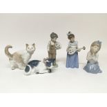 Five Nao figures including two cats, a boy with a football, and two girls