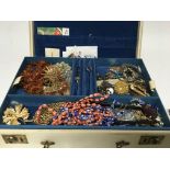 A Jewellery box containing dress jewellery some silver including a silver charm bracelet (a lot)