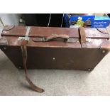 A large leather vintage suit case .