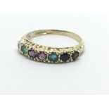 A 9ct gold 'regards' multi stone ring, approx 1.5g