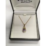 A 9ct gold diamond and amethyst pendant on chain,