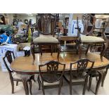 A glazed top mahogany dining table with carved leg