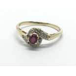 A 9ct gold ruby and diamond swirl ring, approx 1.6