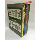 A boxed set of four volumes of 'The Wonderful Worlds Of Walt Disney' published by Grolier of