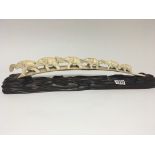 A late 19th century Oriental carved ivory tusk wit