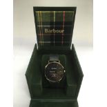 A boxed Barbour watch.