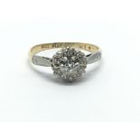 An 18ct yellow gold and platinum seven stone clust