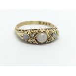 An 18ct gold opal and diamond ring, approx 4g and