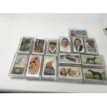 A collection of 14 sets of cigarette cards including Ogdens AFC Nicknames And Churchmans “ Racing