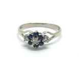 An 18ct gold sapphire and diamond cluster ring, ap