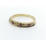 An 18ct gold ruby and diamond half eternity ring,