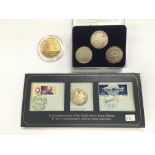 A small collection of coins and medallions comprising an Apollo Soyuz space mission silver proof and