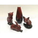 Four more Royal Doulton flambe ware items comprising three animal figures and a vase (4).