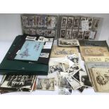 A collection of cigarette cards and old photograph