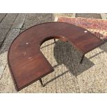 An unusual half moon coffee table with drop leaf ends