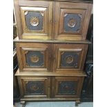 A Victorian walnut three sectional cupboard with Aesthetic influence on cabriole legs and ball and