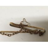 A 9carat gold tie clip with attached chain weight 6g