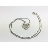 An 18ct white gold diamond set heart shaped pendant on chain, approx 5.4g.