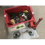 A box containing a collection of playworn toys inc