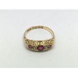 An 18ct gold five stone ruby and diamond ring, approx 2.8g and approx size O-P.