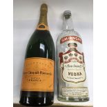 A large Champagne advertising display bottle, approx 49.5cm and a large 3 litre Smirnoff bottle (