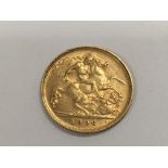 A 1906 George V gold half sovereign.