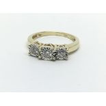 A 9ct gold three stone diamond ring, approx.25ct,