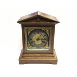 An oak mantle clock having 8 day movement and Roma