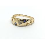 A vintage 18ct gold sapphire and diamond ring, app