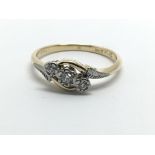 An 18ct gold and platinum three stone diamond ring