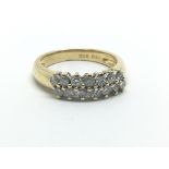 An 18ct gold ring set with 14 diamonds, approx 1/2