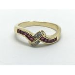 An 18ct gold ruby and diamond ring, approx 3g and approx size L-M.