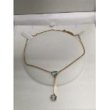 A 9ct gold Art Deco pendant set with two blue coloured stones, approx 4.9g.