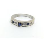 An 18ct white gold princess cut sapphire and diamo