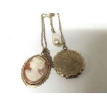 A 9carat gold mounted cameo a gold locket with chain and a simulated pear (3)